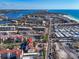 Expansive aerial view showcases the beachfront condos near the intercoastal, tennis court and the ocean at 6263 Midnight Pass Rd # 105, Sarasota, FL 34242