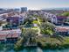 A coastal community featuring condos, waterway access, lush landscaping, and inviting amenities at 6263 Midnight Pass Rd # 105, Sarasota, FL 34242