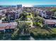 A coastal community featuring condos, waterway access, lush landscaping, and inviting amenities at 6263 Midnight Pass Rd # 105, Sarasota, FL 34242