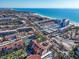 Stunning aerial view of beachfront condos with beautiful ocean views and tropical landscaping near the beach at 6263 Midnight Pass Rd # 105, Sarasota, FL 34242