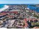 Scenic aerial view of the community near a beach, showing residential buildings, roads, and beach access at 6263 Midnight Pass Rd # 105, Sarasota, FL 34242