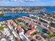 A coastal community featuring condos, a tennis court, and waterfront views with easy access to a dock at 6263 Midnight Pass Rd # 105, Sarasota, FL 34242