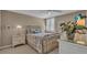 Cozy bedroom with neutral color scheme, bedside tables, ceiling fan, and shuttered windows at 6263 Midnight Pass Rd # 105, Sarasota, FL 34242