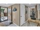 Foyer with tiled floors, modern decor, an exterior door, and interior door at 6263 Midnight Pass Rd # 105, Sarasota, FL 34242