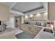 Bright kitchen featuring white cabinetry, marble countertops, and stainless appliances at 6263 Midnight Pass Rd # 105, Sarasota, FL 34242