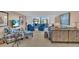 Cozy living room featuring comfortable seating, stylish decor, and ample natural light at 6263 Midnight Pass Rd # 105, Sarasota, FL 34242