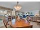 Open floor plan with modern furniture and light fixtures in the living and dining areas at 6263 Midnight Pass Rd # 105, Sarasota, FL 34242