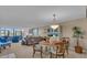 Inviting living room with comfortable seating, bright windows, and neutral tones at 6263 Midnight Pass Rd # 105, Sarasota, FL 34242