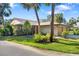 Lovely single-story home with mature trees, green grass, and a well-maintained front lawn at 6650 Schooner Bay Cir # 6650, Sarasota, FL 34231