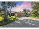Charming single-story home featuring a two-car garage, lush landscaping, and a long driveway at 6650 Schooner Bay Cir # 6650, Sarasota, FL 34231