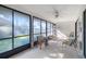 Bright lanai with tile flooring, ceiling fan, and view of the outdoors at 6650 Schooner Bay Cir # 6650, Sarasota, FL 34231