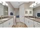 Beautifully designed bathroom with double sinks and a glass-enclosed shower at 6907 Costa Bella Dr, Bradenton, FL 34209