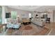 Spacious living room with neutral decor, plush seating, and abundant natural light at 6907 Costa Bella Dr, Bradenton, FL 34209