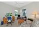Office space featuring a couch, desk, bookcase, and natural light from two windows at 6907 Costa Bella Dr, Bradenton, FL 34209