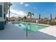 Inviting community pool with clear water, lounge chairs, and meticulously landscaped surroundings at 6907 Costa Bella Dr, Bradenton, FL 34209