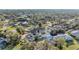 An aerial view capturing the pool, landscaping and neighborhood at 7912 Desoto Memorial Hwy, Bradenton, FL 34209