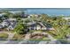Expansive aerial view of a waterfront home, showcasing the property's prime location and lush surroundings at 7912 Desoto Memorial Hwy, Bradenton, FL 34209