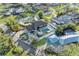 Aerial view of a luxurious home featuring a swimming pool, manicured grounds, and serene surroundings at 7912 Desoto Memorial Hwy, Bradenton, FL 34209