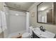 Clean bathroom featuring a walk-in shower, toilet, and a black framed mirror at 7912 Desoto Memorial Hwy, Bradenton, FL 34209