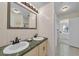 Well-lit bathroom boasting double sinks, a large mirror, and a walk-in shower at 7912 Desoto Memorial Hwy, Bradenton, FL 34209