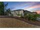 Stunning two-story home boasting large windows, stone accents, and mature landscaping in a desirable neighborhood at 7912 Desoto Memorial Hwy, Bradenton, FL 34209