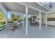 A lovely outdoor patio that features ample seating and overhead shade, perfect for entertaining or relaxing outdoors at 7912 Desoto Memorial Hwy, Bradenton, FL 34209