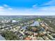 An aerial view of the home and surrounding community with a pin to the listing at 8579 Woodbriar Dr, Sarasota, FL 34238