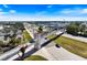 An aerial view of a pedestrian bridge providing safe passage over a busy road in Sarasota, Florida at 8579 Woodbriar Dr, Sarasota, FL 34238