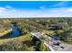 Aerial view of a community surrounded by lakes and mature trees, showcasing Florida's natural beauty at 8579 Woodbriar Dr, Sarasota, FL 34238
