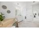 Open and airy bathroom with soaking tub and ample vanity space at 8579 Woodbriar Dr, Sarasota, FL 34238