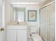 Bathroom with vanity, toilet, and glass-enclosed shower area at 8579 Woodbriar Dr, Sarasota, FL 34238