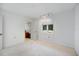 Bright bedroom featuring neutral carpet, window with blind, and a closet at 8579 Woodbriar Dr, Sarasota, FL 34238