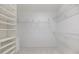 Spacious walk-in closet with shelving and drawers for optimal storage at 8579 Woodbriar Dr, Sarasota, FL 34238