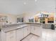 Contemporary kitchen with updated countertops and adjacent living area at 8579 Woodbriar Dr, Sarasota, FL 34238