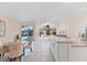 Bright kitchen with eat-in area, granite counters, stainless appliances, and modern fixtures at 8579 Woodbriar Dr, Sarasota, FL 34238