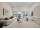 Spacious living room featuring sliding glass doors leading to the outdoor patio and a large window at 8579 Woodbriar Dr, Sarasota, FL 34238