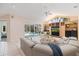 Bright living room featuring high ceilings, built-in shelving, and a comfortable seating area at 8579 Woodbriar Dr, Sarasota, FL 34238