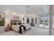 Bright main bedroom with a seating area and access to the lanai at 8579 Woodbriar Dr, Sarasota, FL 34238