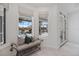 Sun-filled sitting area overlooking the lanai and pool area at 8579 Woodbriar Dr, Sarasota, FL 34238