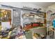 Organized storage area featuring shelving, drawers, tools, and a fire extinguisher for safety and convenience at 8579 Woodbriar Dr, Sarasota, FL 34238