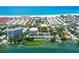 Aerial view showcasing the building's proximity to the beach and waterfront access at 1200 E Peppertree Ln # 305, Sarasota, FL 34242