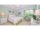 This cozy bedroom features a bright, airy space with a comfortable queen-size bed and classic decor at 1200 E Peppertree Ln # 305, Sarasota, FL 34242