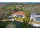 Aerial view of the backyard with a pool and waterfront access featuring a private boat dock on the canal at 1240 Northport Dr, Sarasota, FL 34242