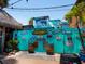 Eclectic Siesta Key building featuring surfboards, murals, and tropical-themed decor at 1240 Northport Dr, Sarasota, FL 34242