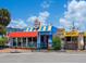 Brightly colored buildings featuring the Lobster Pot and Mini Donuts in a bustling area at 1240 Northport Dr, Sarasota, FL 34242