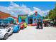 Robin Hood Rentals building with a variety of colorful rental vehicles parked outside at 1240 Northport Dr, Sarasota, FL 34242