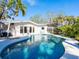 Backyard pool with a patio and screened-in porch, perfect for outdoor living at 1240 Northport Dr, Sarasota, FL 34242