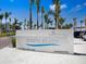 The Siesta Beach sign, located at Sarasota County Park, is surrounded by palm trees along the street at 1240 Northport Dr, Sarasota, FL 34242