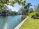 Scenic canal view with lush greenery and clear blue skies at 1240 Northport Dr, Sarasota, FL 34242