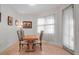 Dining area features a wooden table and chairs, next to window at 13303 Swiftwater Way, Lakewood Ranch, FL 34211